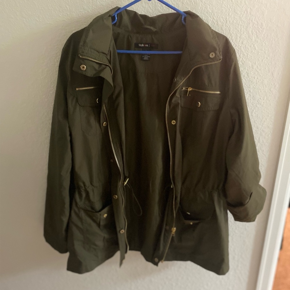 Olive green windbreaker jacket with gold detail
